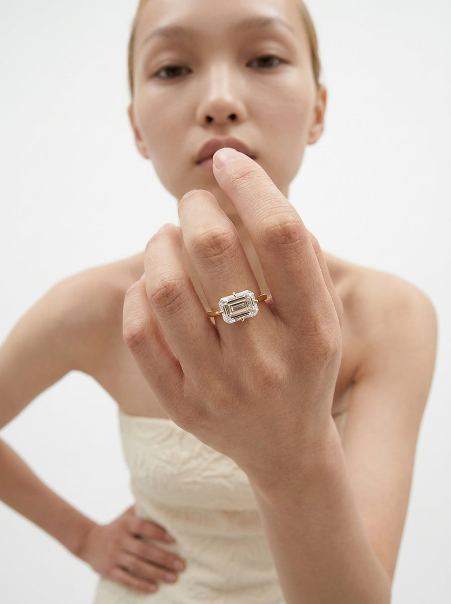 East-West Emerald engagement ring by MARLII LAB — emerald cut centre diamond, 18K Yellow Gold, second view