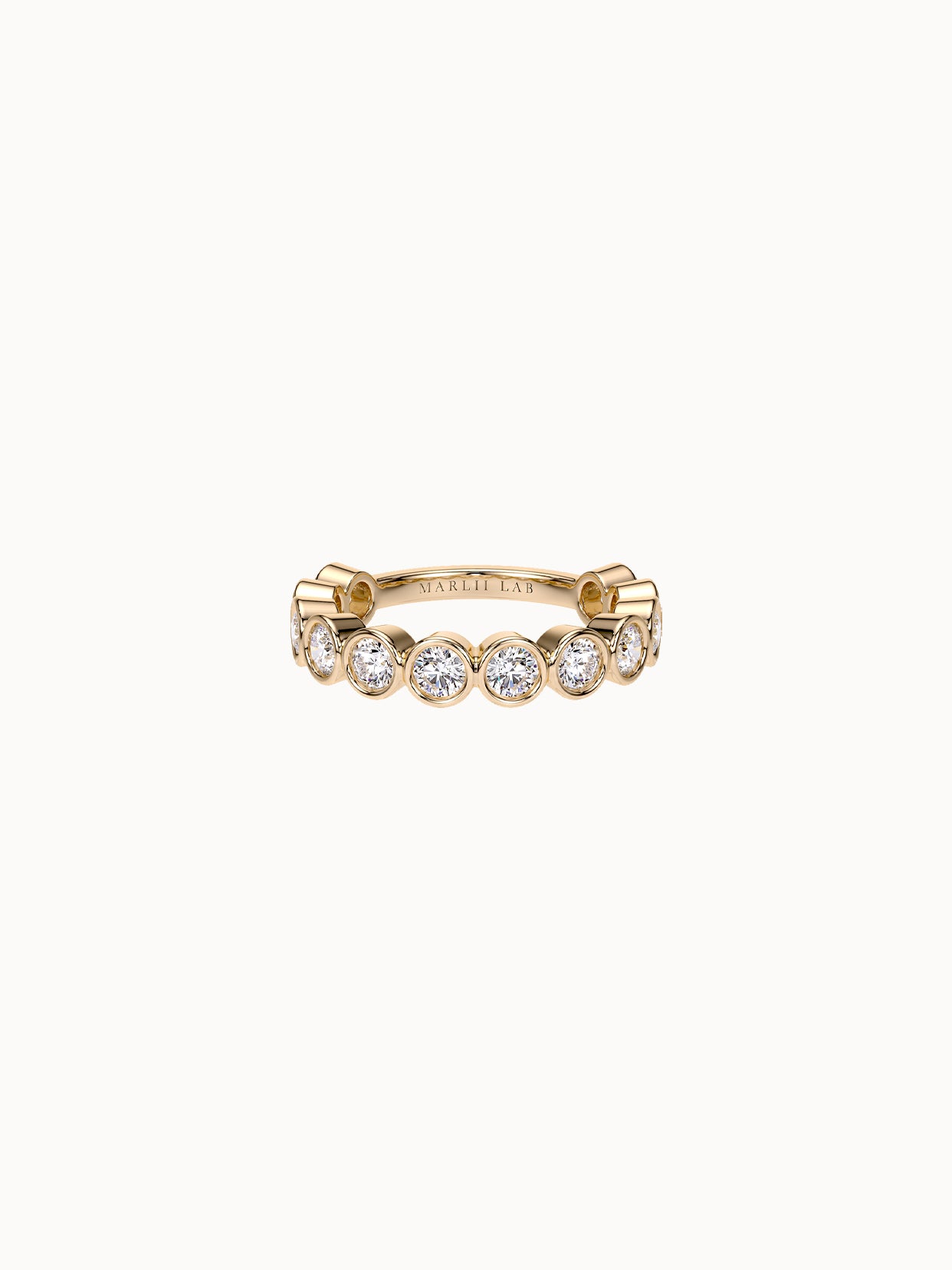 East-West Bezel Round Band Petite in 18K yellow gold, round diamonds bezel set in a row