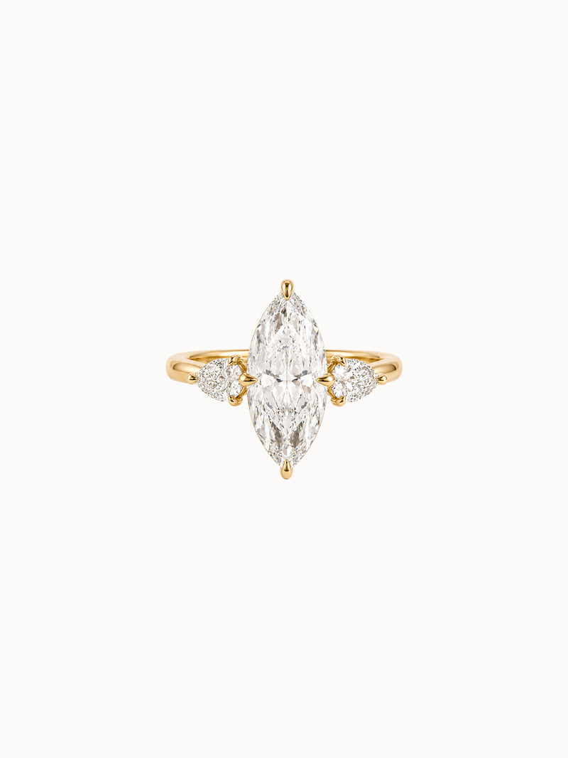 Marquise & Pear Trilogy engagement ring by MARLII LAB — marquise centre diamond, three-stone setting, 18K Yellow Gold