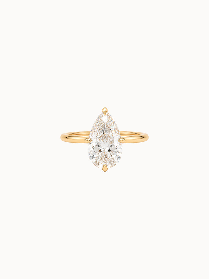 Compass Pear engagement ring by MARLII LAB — pear centre diamond, four-claw setting, 18K Yellow Gold