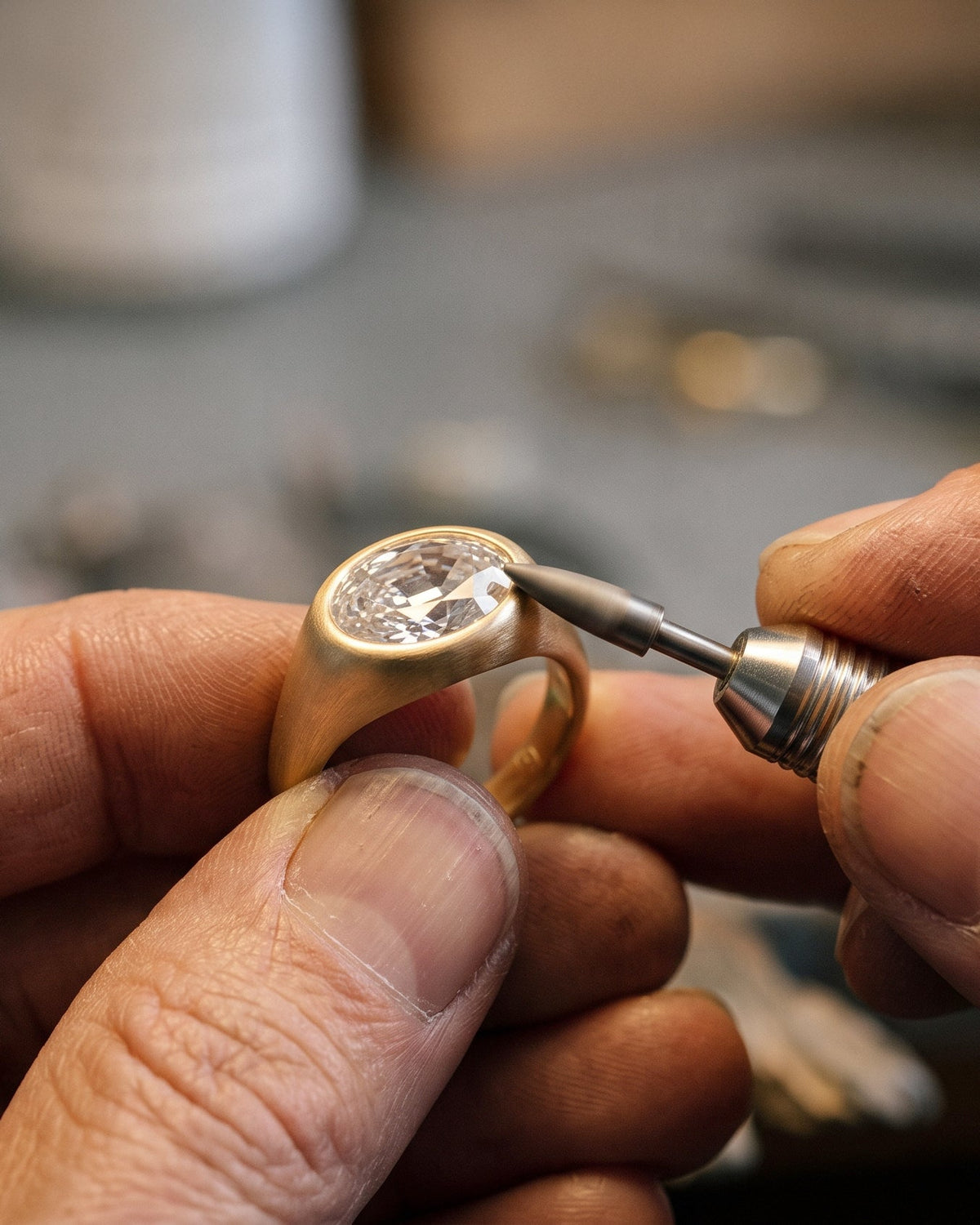 An oval diamond ring being finished by hand at the bench in the MARLII LAB London workshop