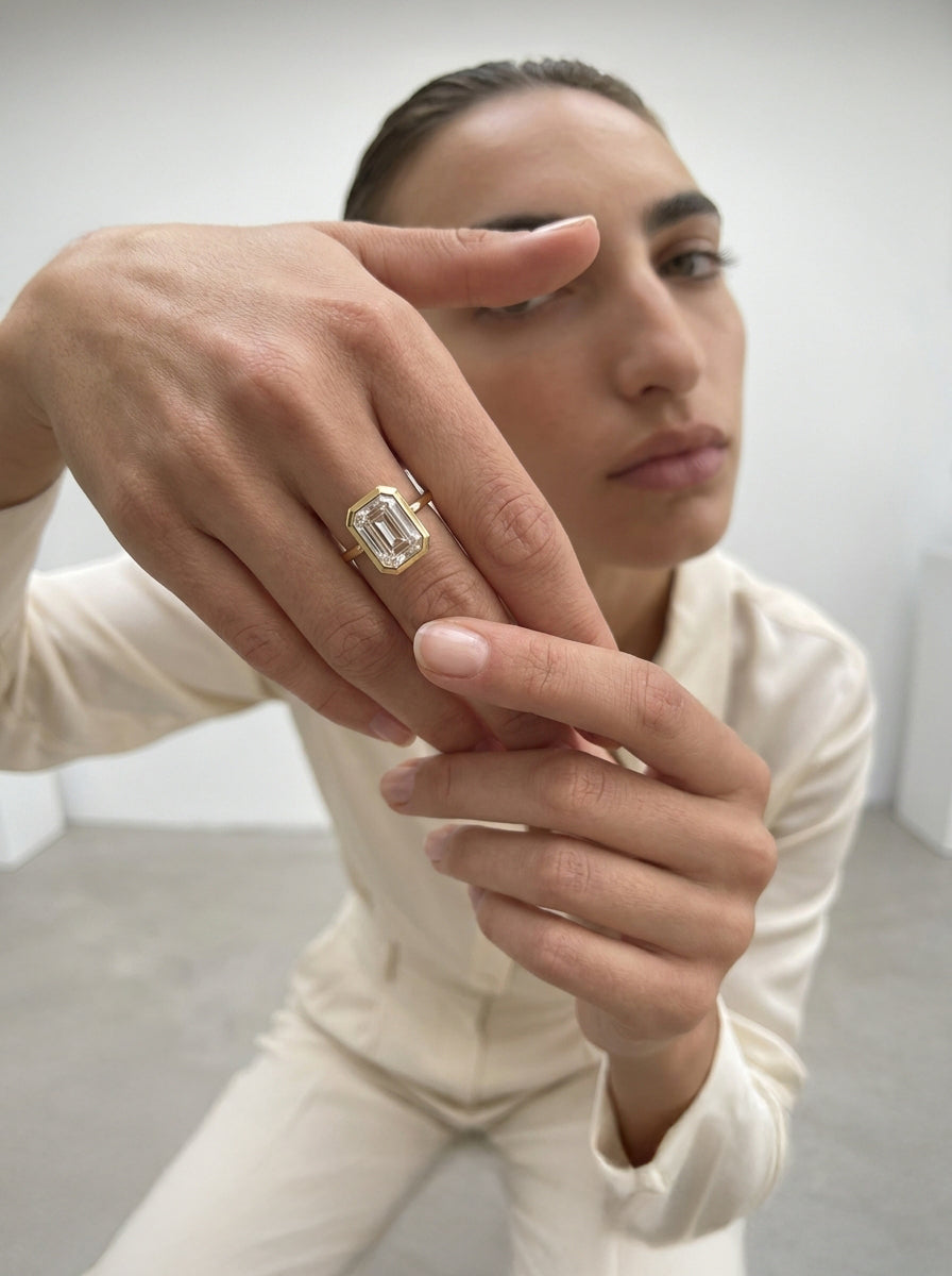 Framed Emerald engagement ring by MARLII LAB — emerald cut centre diamond, bezel setting, 18K Yellow Gold, second view