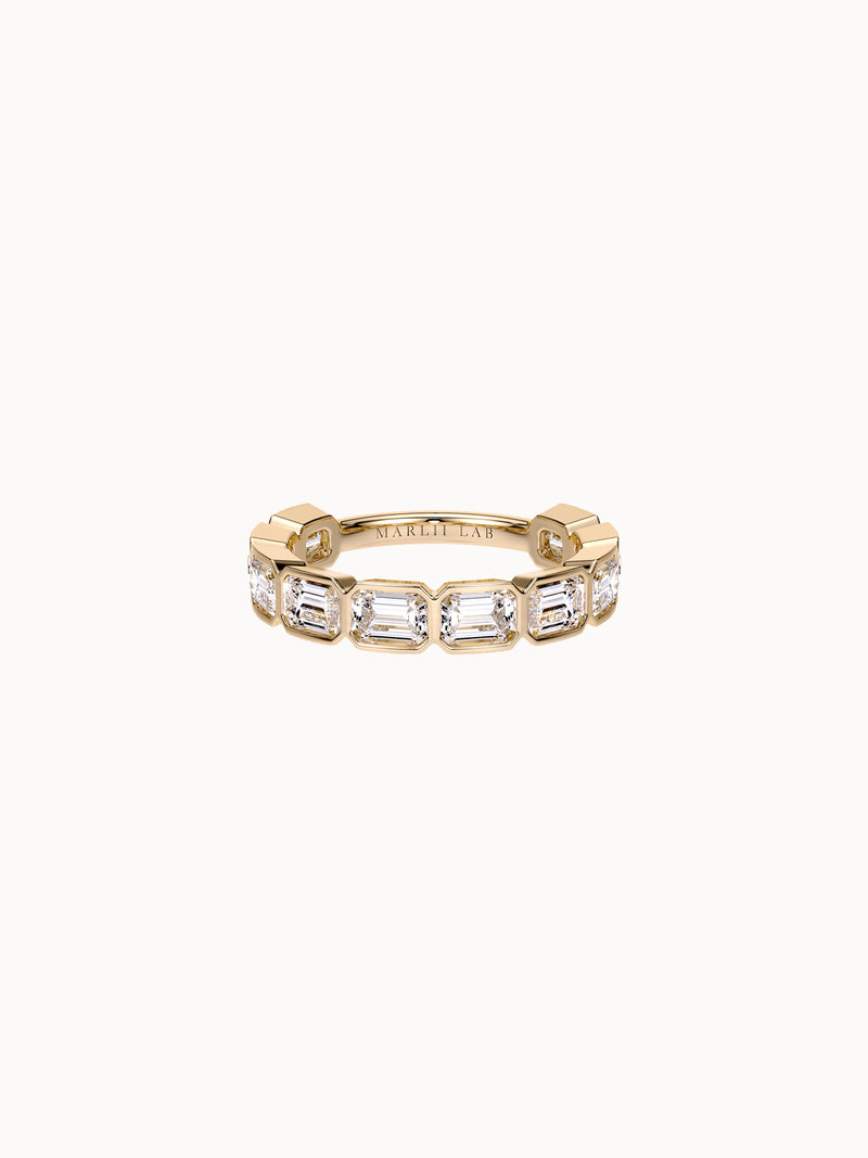 East-West Bezel Emerald Band Grand in 18K yellow gold, emerald cut diamonds bezel set east-west