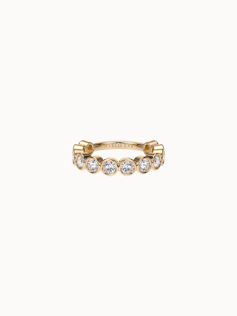 East-West Bezel Round Band Petite in 18K yellow gold, round diamonds bezel set in a row