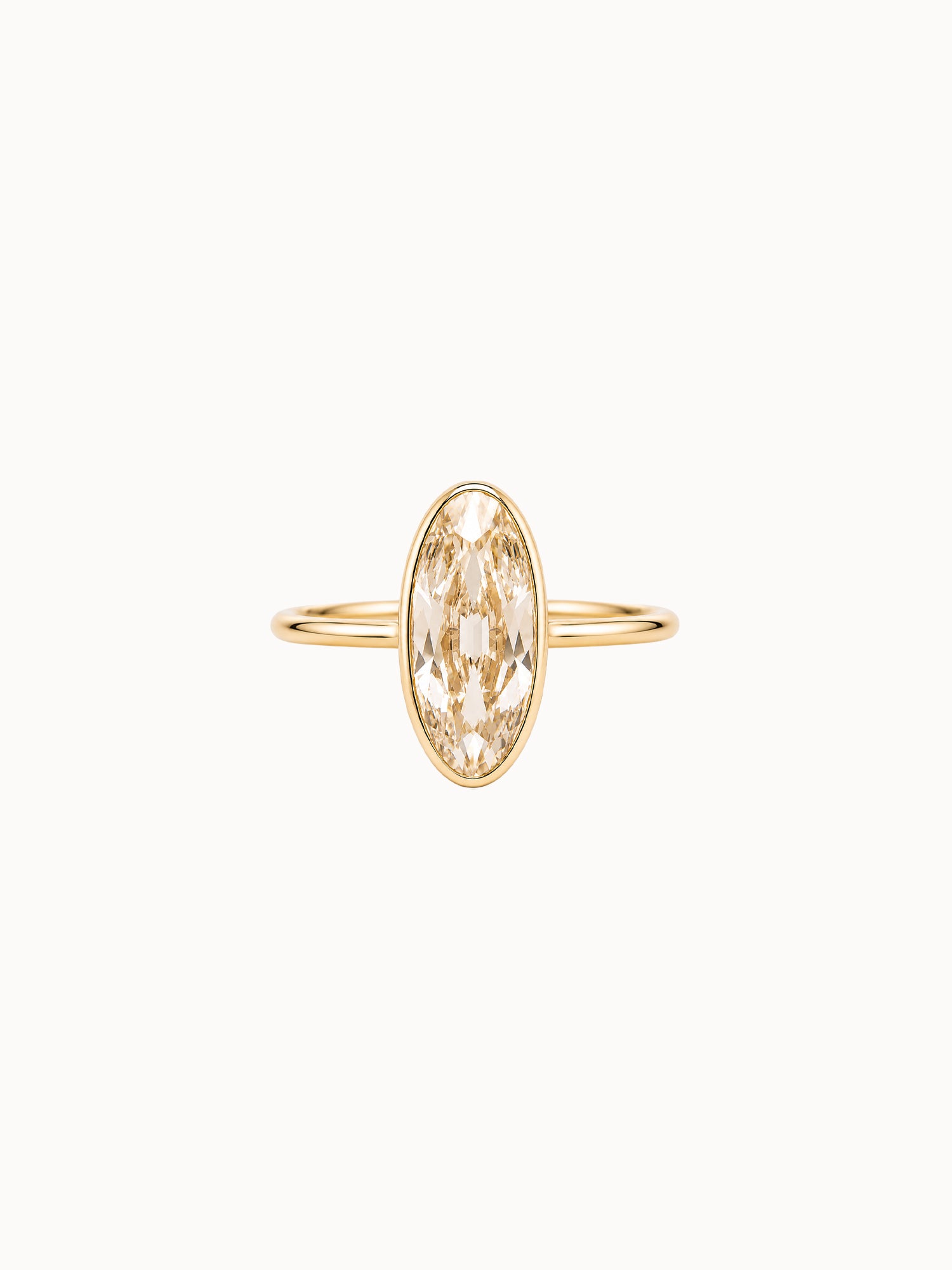 Bezel Champagne Moval engagement ring by MARLII LAB — moval centre diamond, bezel setting, 18K Yellow Gold