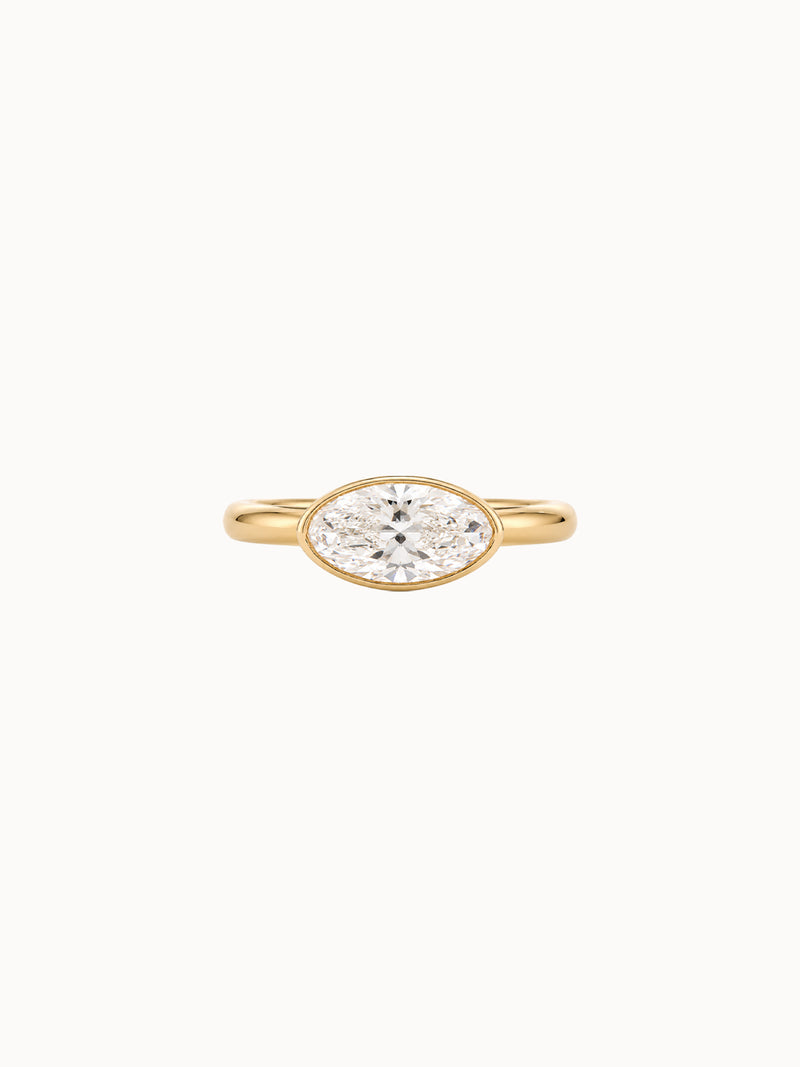 East-West Bezel Oval engagement ring by MARLII LAB — oval centre diamond, bezel setting, 18K Yellow Gold