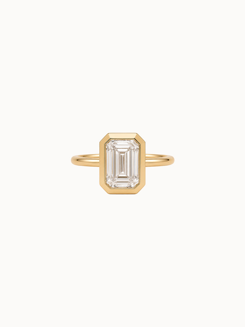 Framed Emerald engagement ring by MARLII LAB — emerald cut centre diamond, bezel setting, 18K Yellow Gold