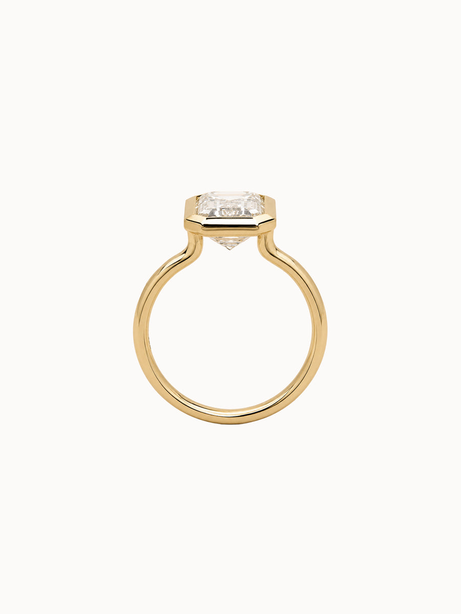 Framed Emerald engagement ring by MARLII LAB — emerald cut centre diamond, bezel setting, 18K Yellow Gold, third view