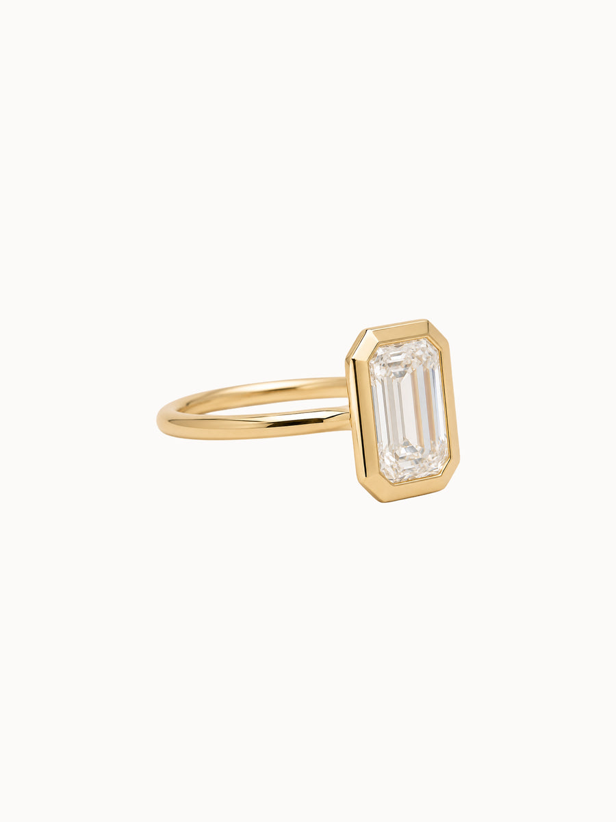 Framed Emerald engagement ring by MARLII LAB — emerald cut centre diamond, bezel setting, 18K Yellow Gold, fourth view
