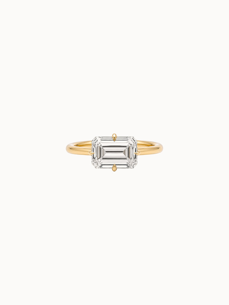 East-West Emerald engagement ring by MARLII LAB — emerald cut centre diamond, 18K Yellow Gold