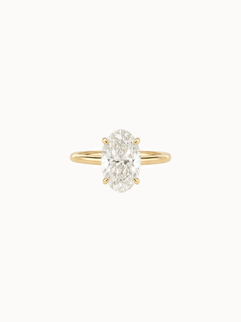 Cutaway Oval engagement ring by MARLII LAB — oval centre diamond, four-claw setting, 18K Yellow Gold