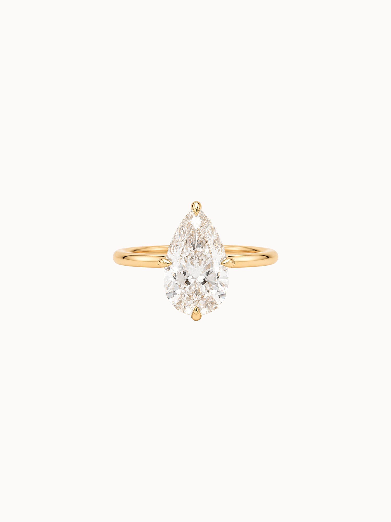 Compass Pear engagement ring by MARLII LAB — pear centre diamond, four-claw setting, 18K Yellow Gold