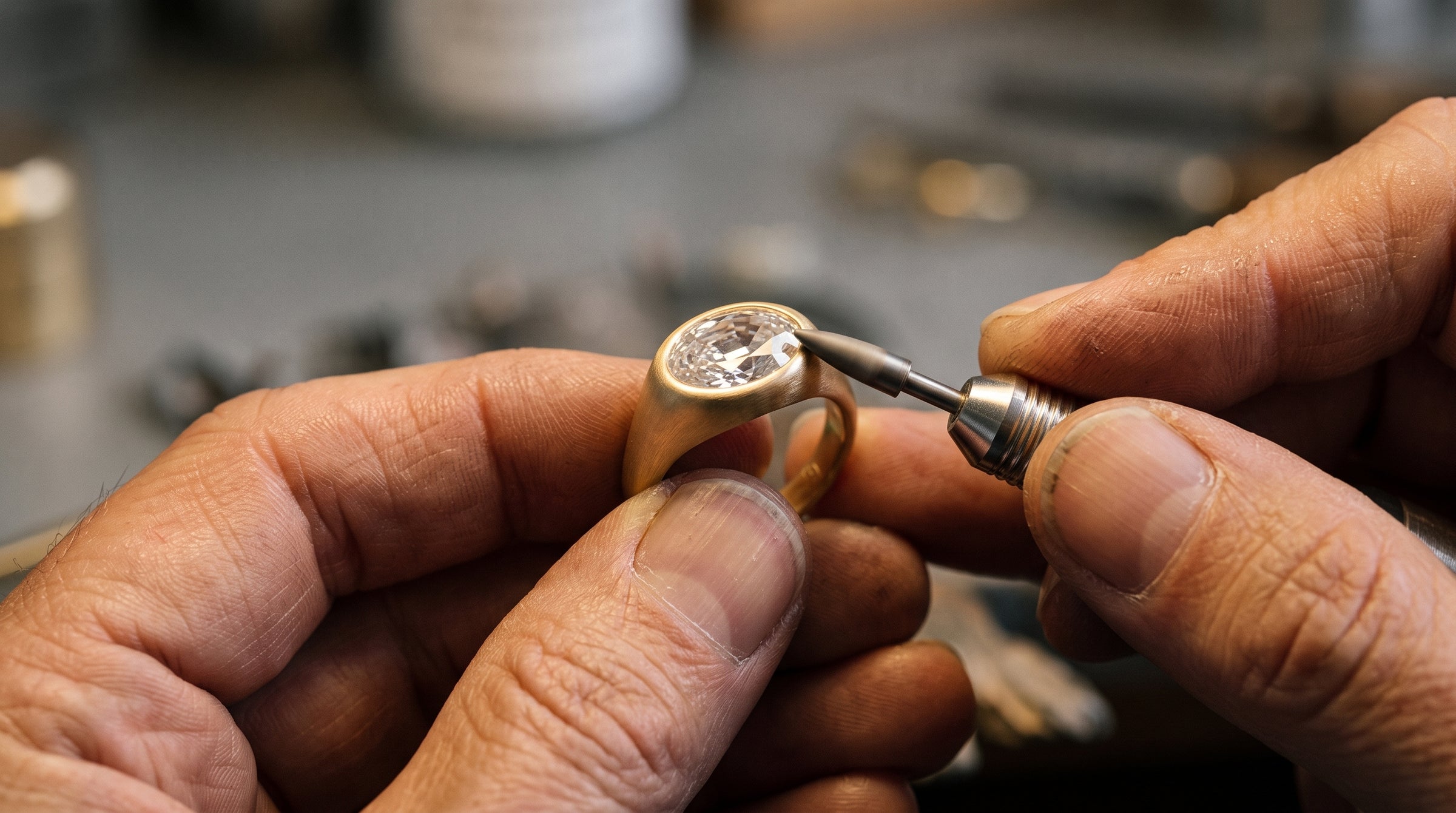 A MARLII LAB oval diamond ring being finished by hand at the bench in the London workshop